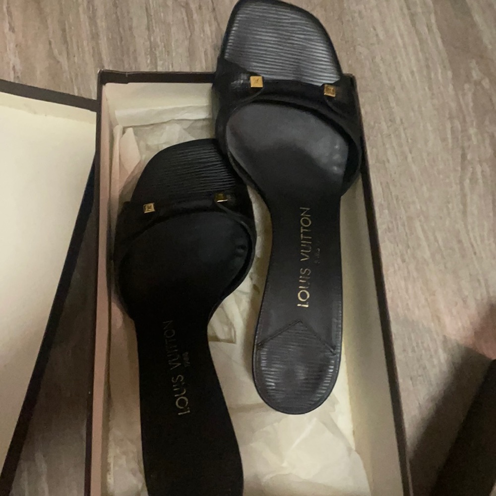 Used slip on Sandal with heels. In good condition